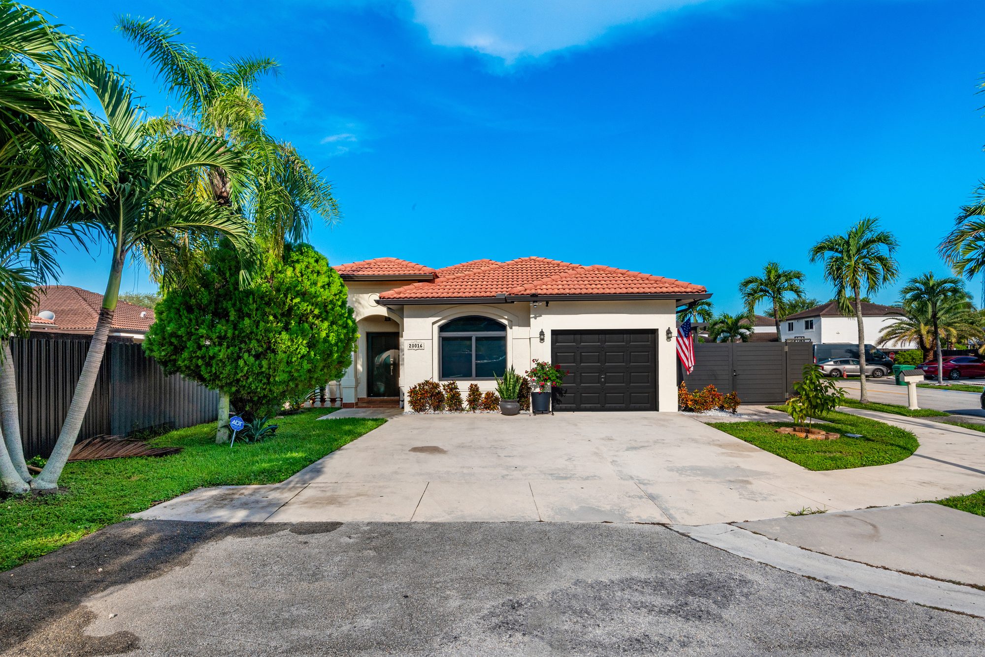 Front of the home with driveway and attached garage
