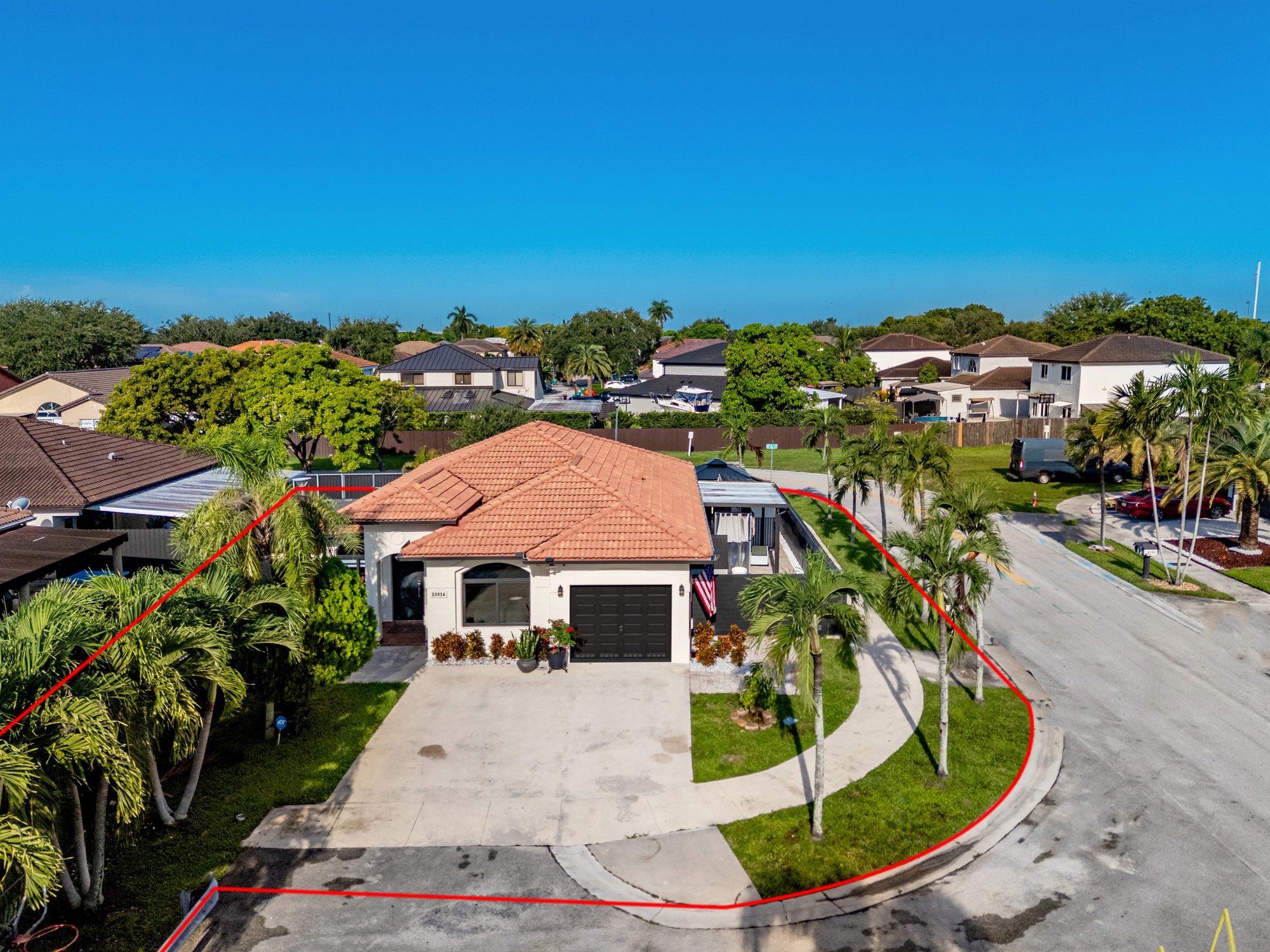 Drone view of the home and corner lot