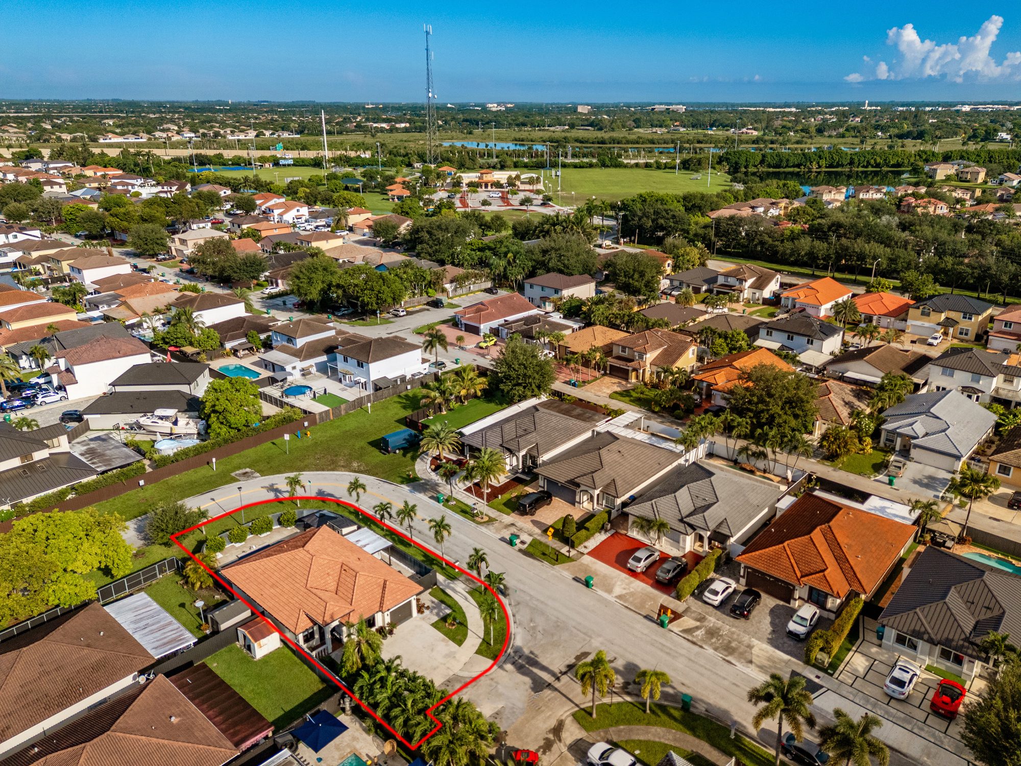 Drone view of the home and surrounding streets