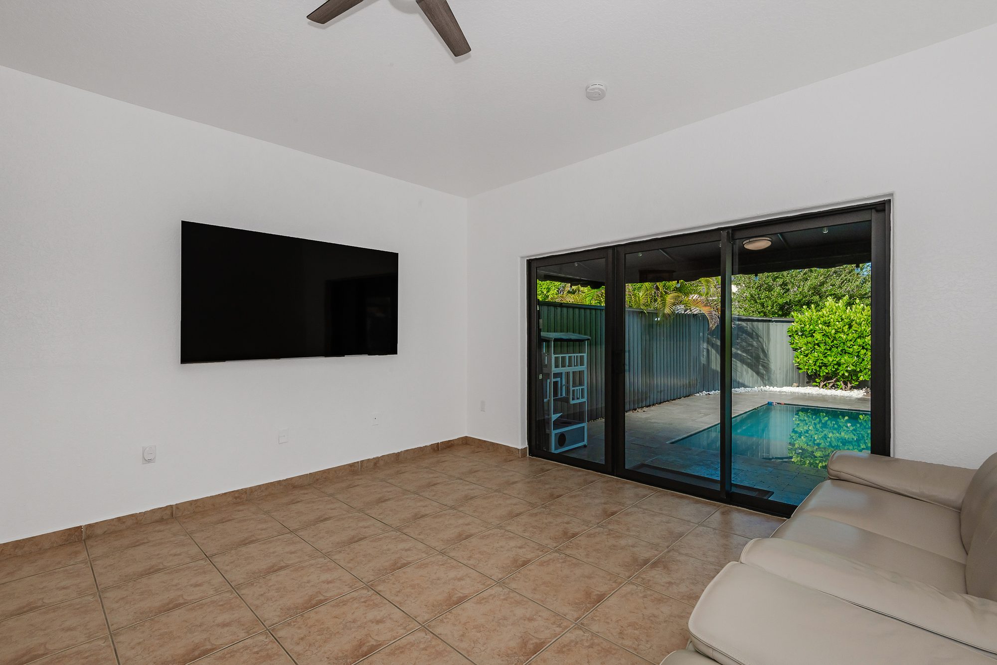 Living room with sliding doors to the pool