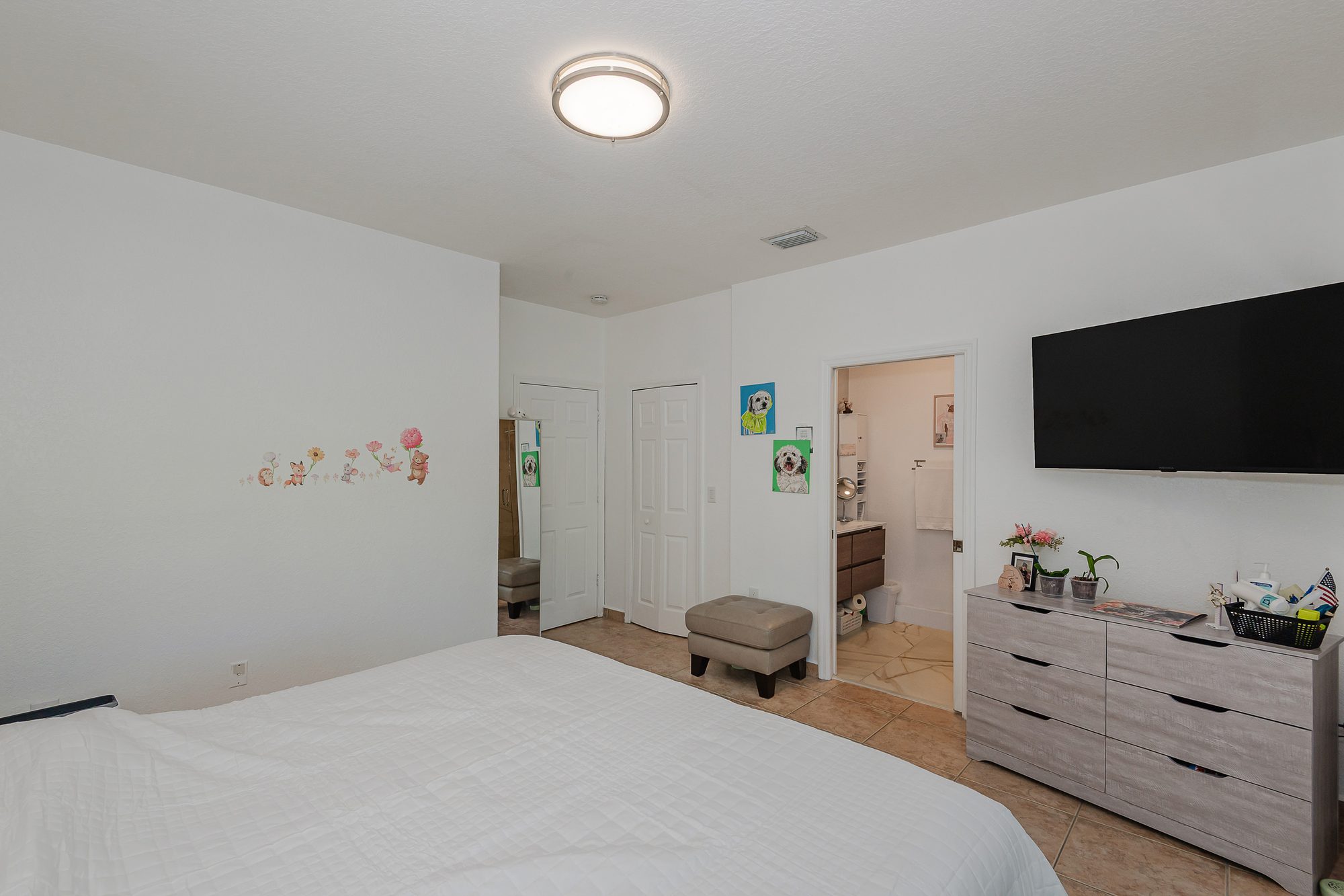 Primary bedroom with access to the bath