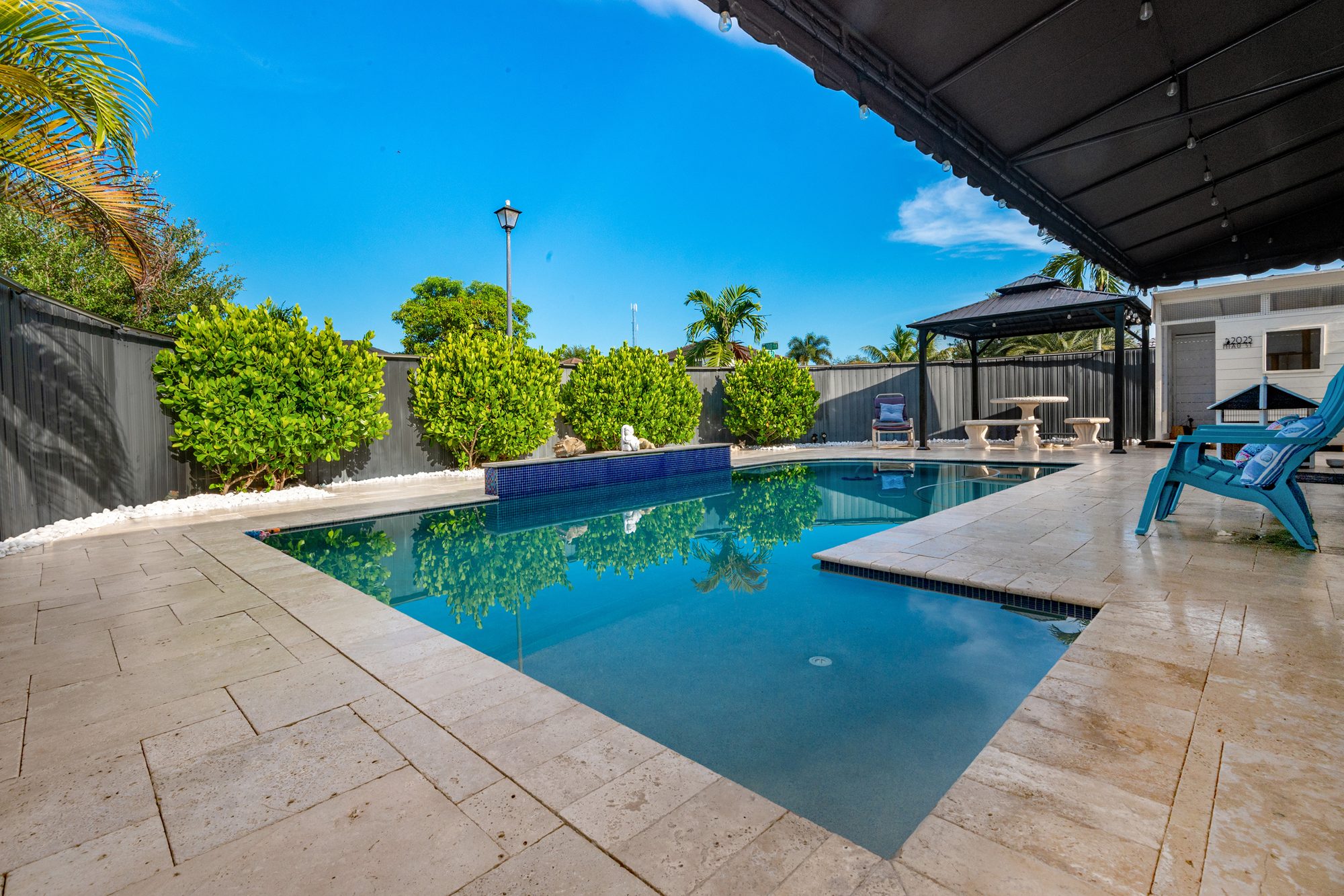 Saltwater pool and travertine-style patio