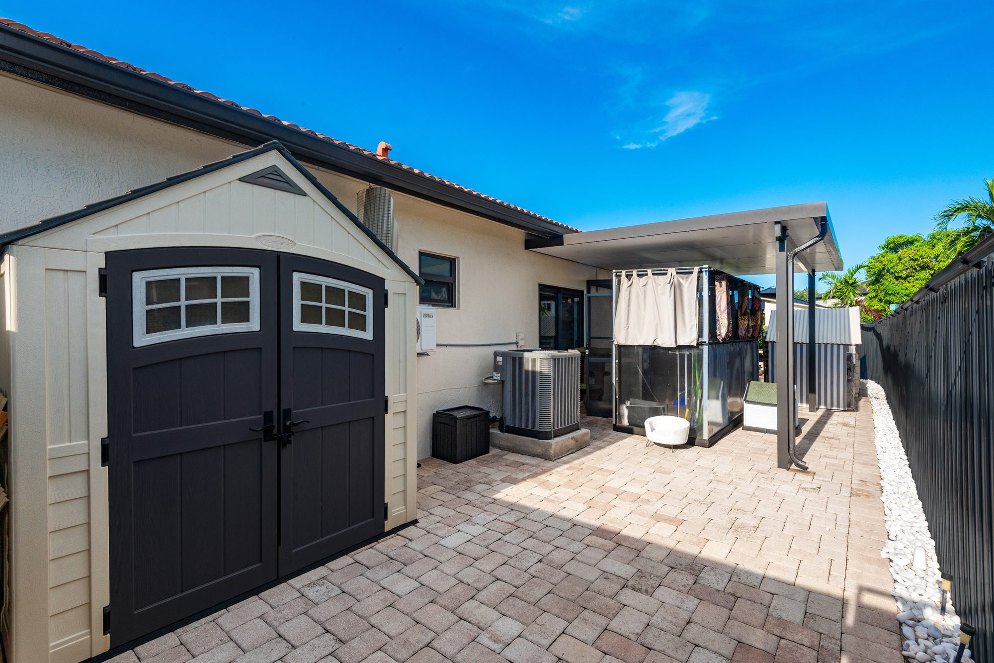 Side yard with storage shed and pavers